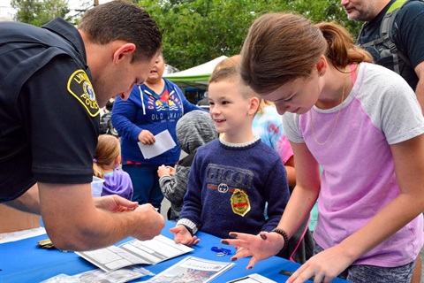 Kids engage with police officer