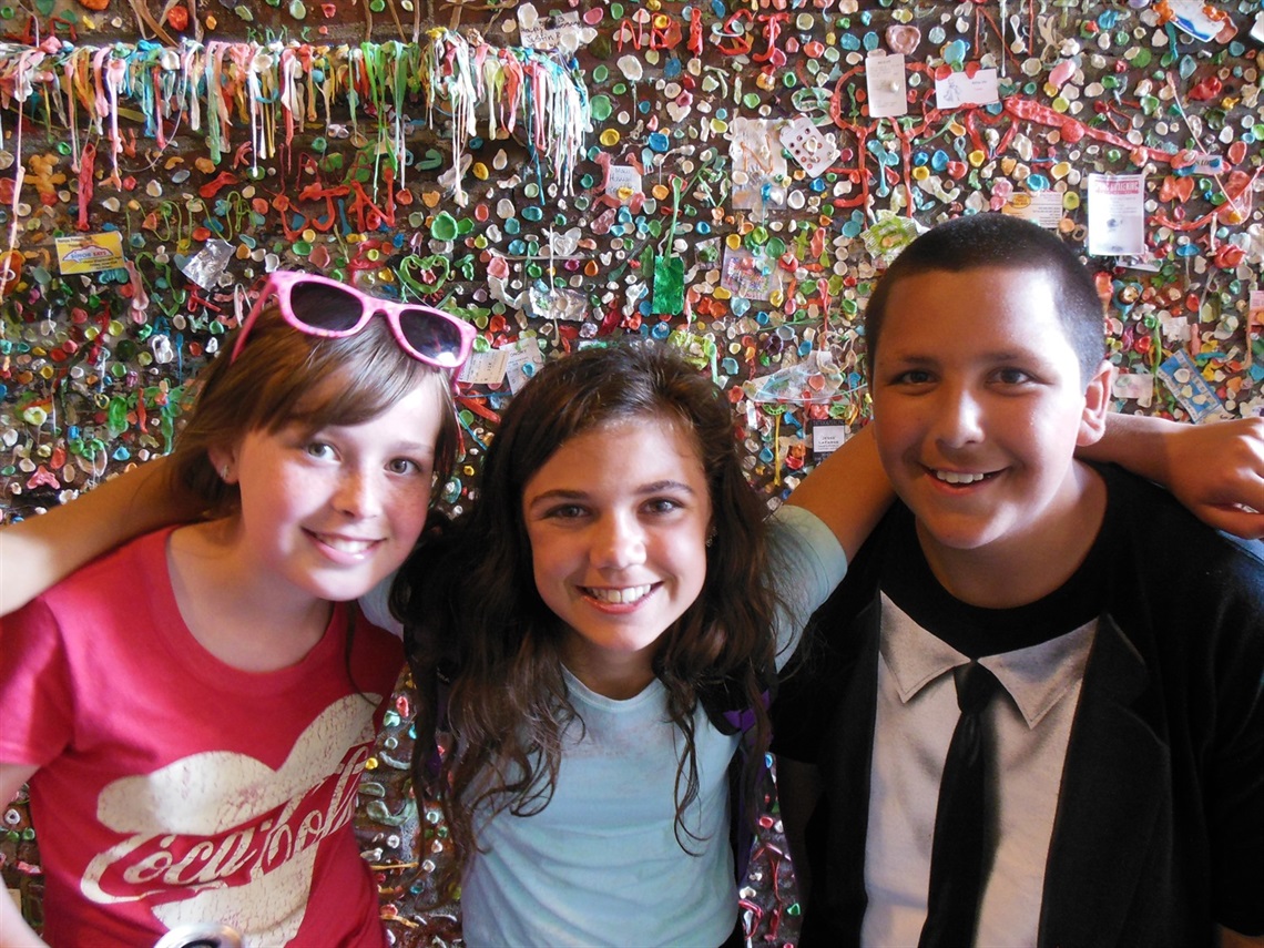 Teens in front of Gum Wall in Seattle