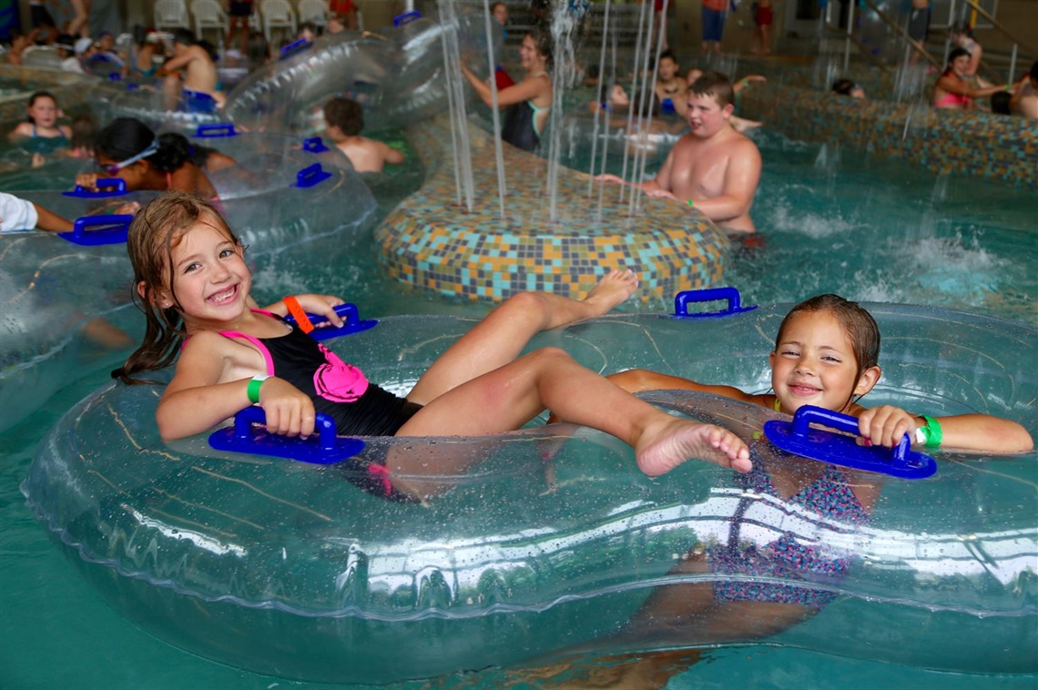 Girls floating on tubes in Pool.jpg