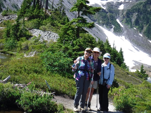 Three women hiking outside