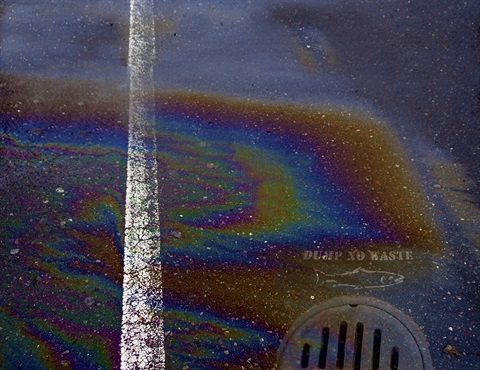 Photo of oil sheen on pavement 