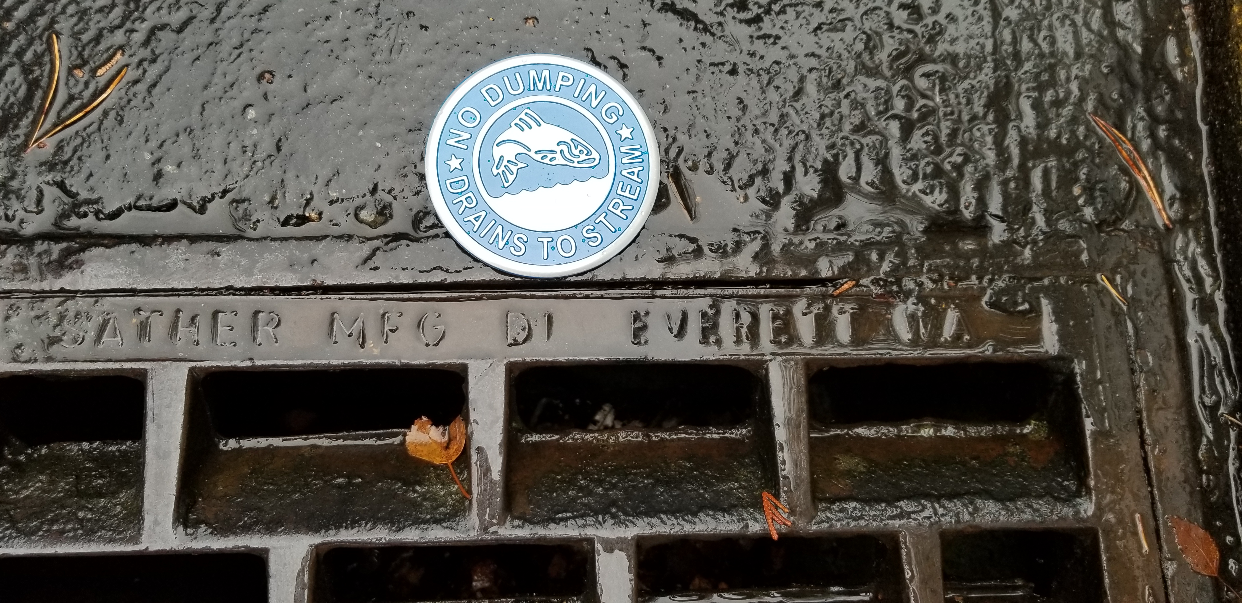 Photo of a storm drain maker that reads 